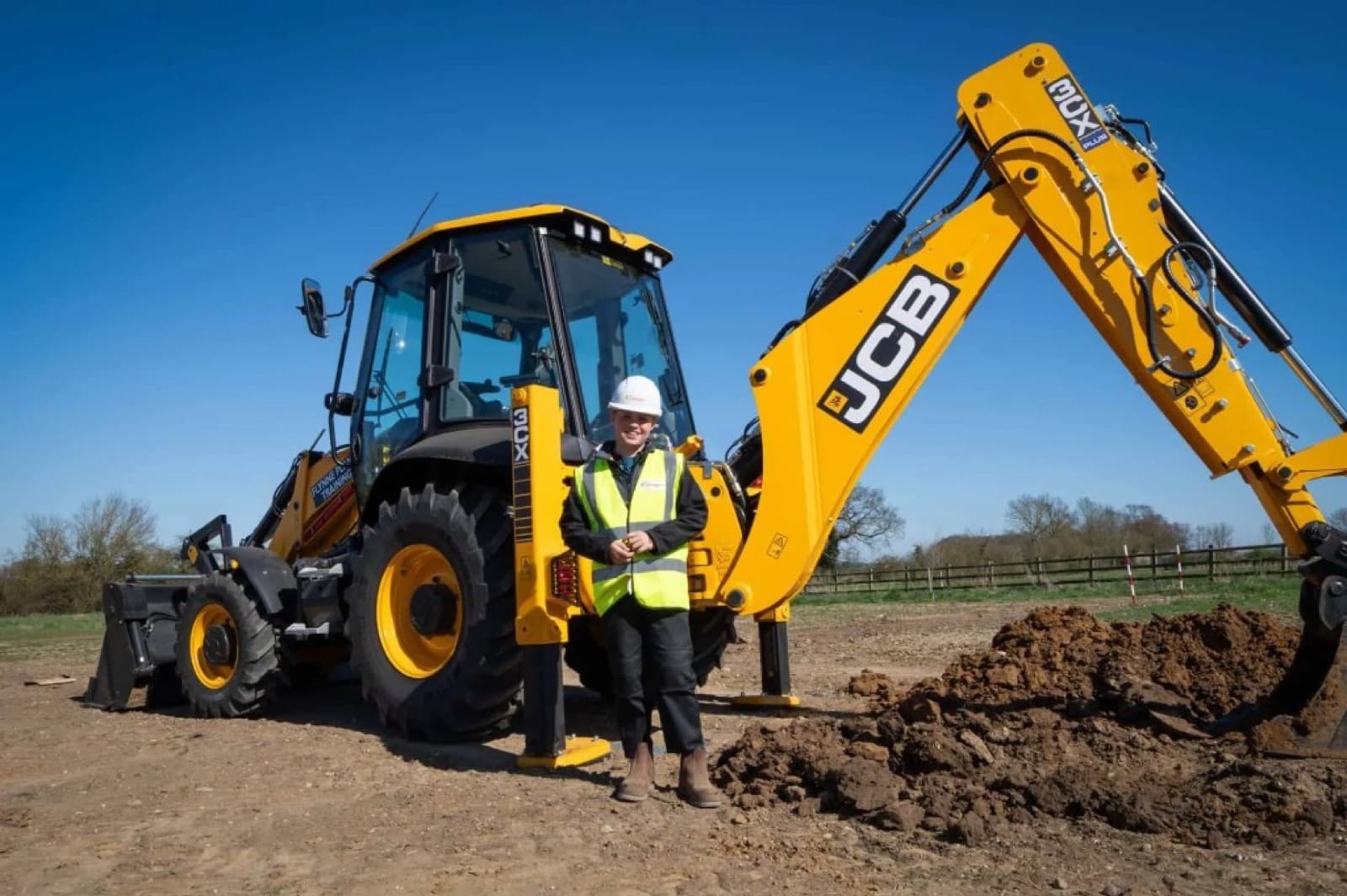 A JCB backhoe loader on a UK site, the kind of plant financed on asset finance