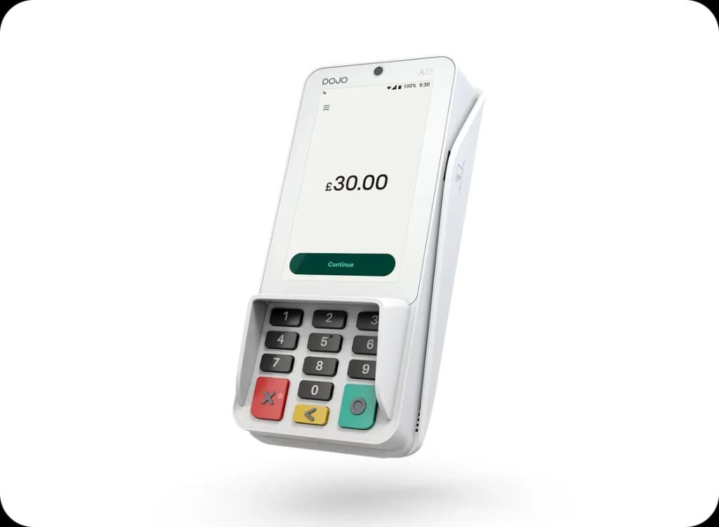 Dojo Wired flat on countertop showing Approved screen