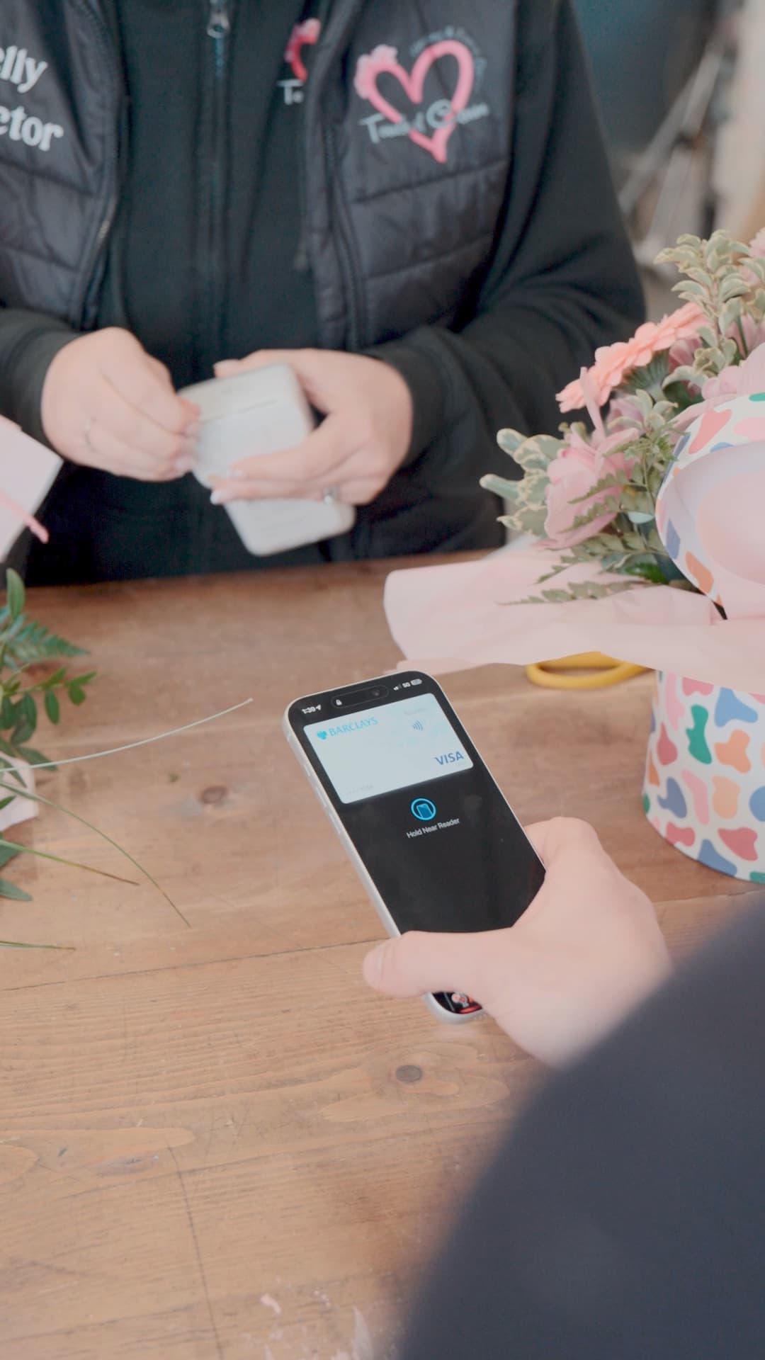 Customer making a contactless payment on Dojo